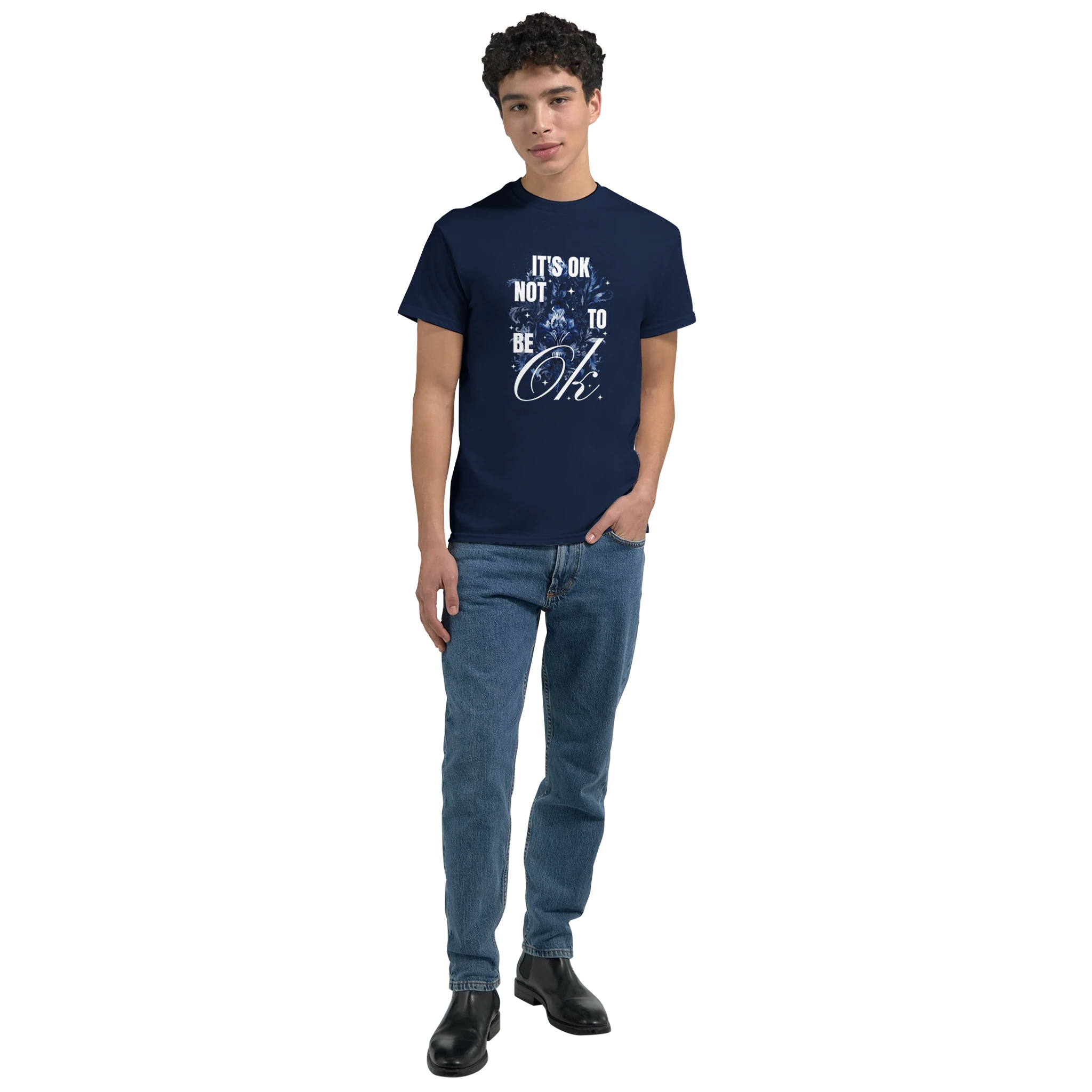 Male model wearing navy cotton-blend T-shirt featuring white 'It's OK Not To Be OK' graphic.