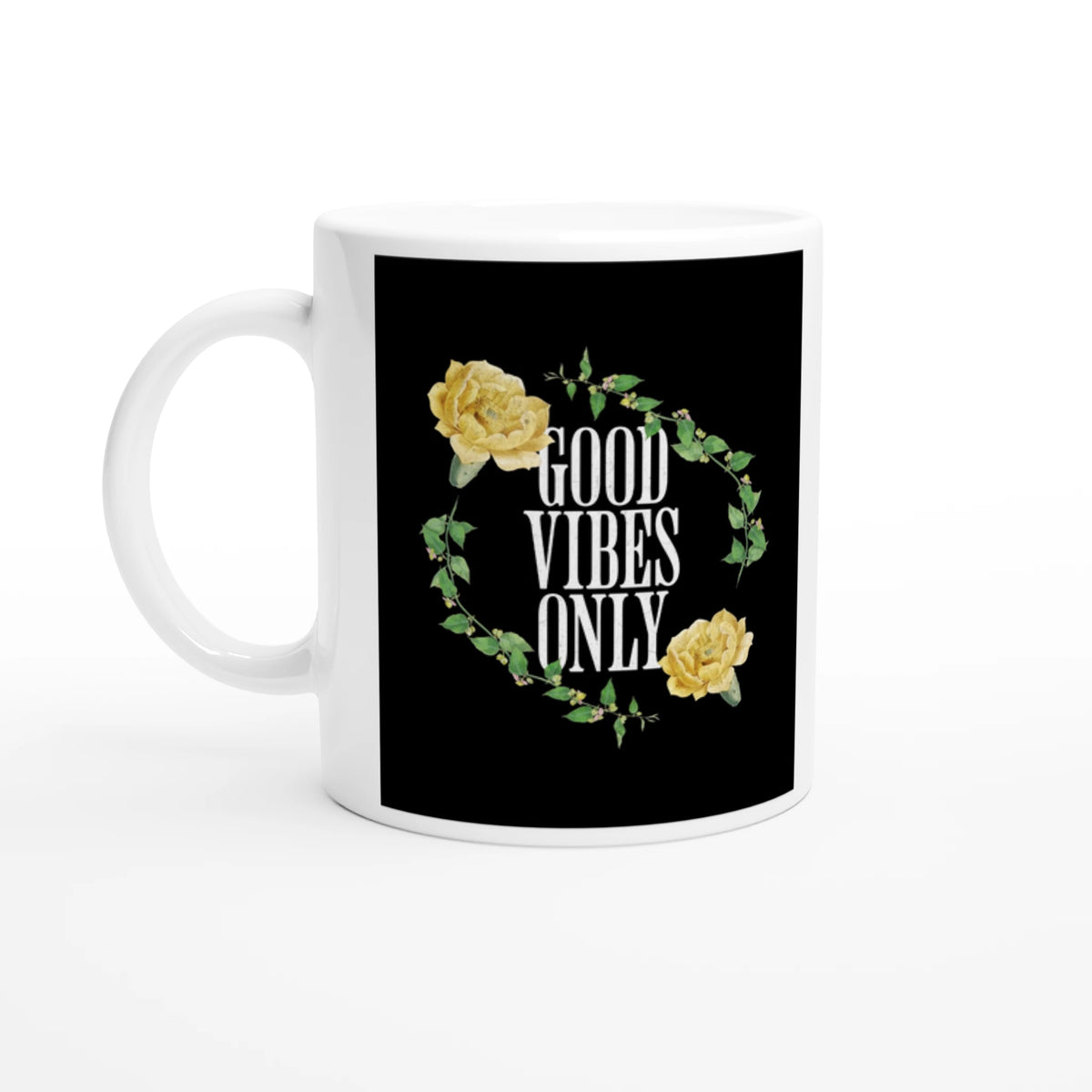White ceramic mug with a black panel showing GOOD VIBES ONLY, surrounded by a floral vine and yellow roses.