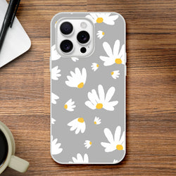 Ditsy Daisy iPhone Case (13-16) with slim matte floral print on gray, white daisies and yellow centers.