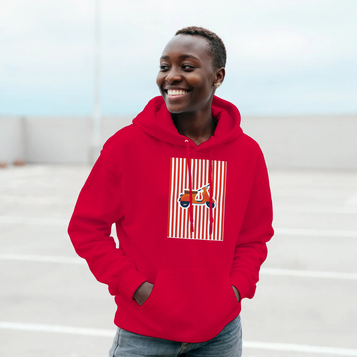 Woman wearing red Vintage Mod style pullover hoodie featuring a retro scooter graphic on vertical striped background.