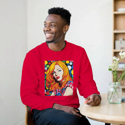 Man wearing a red sweatshirt with a colorful pop-art portrait of a woman on the front.