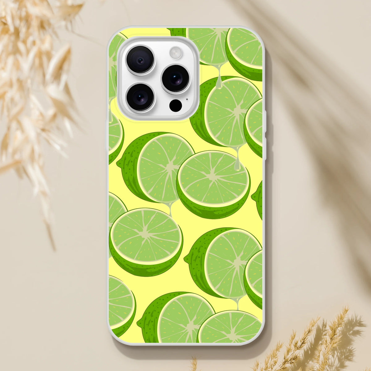 Lime-slice iPhone case for 13-16 with a slim matte shell and vibrant lime print on a yellow background.