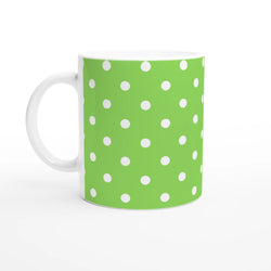 Green ceramic mug featuring white polka dots. Cute spotty coffee cup design for daily tea or coffee drinks.