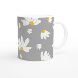Ditsy Daisy Mug: gray ceramic cup with white daisies and yellow centers, white handle.