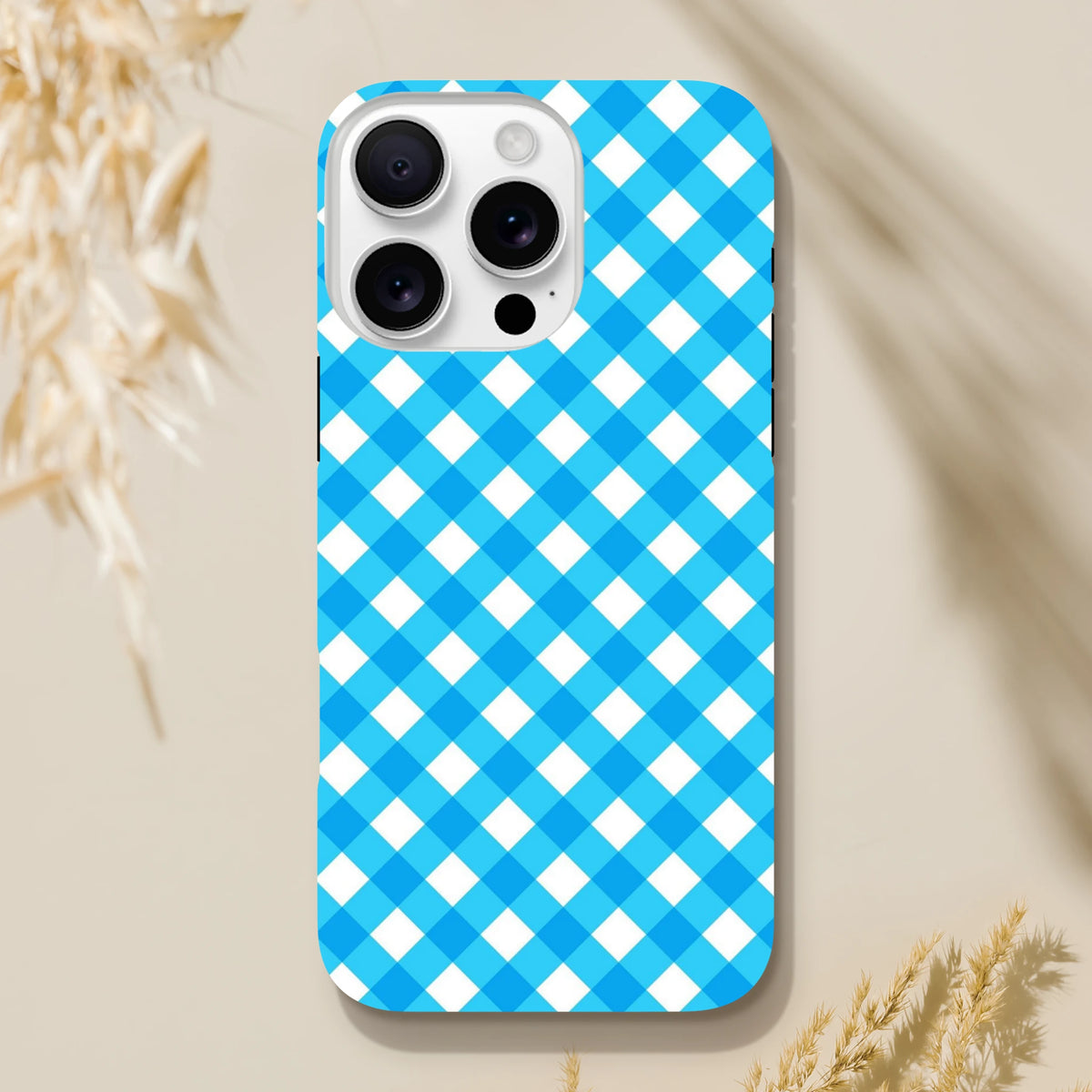 Retro blue gingham checkered tough iPhone case providing shock absorption and wireless charging compatibility for daily use.