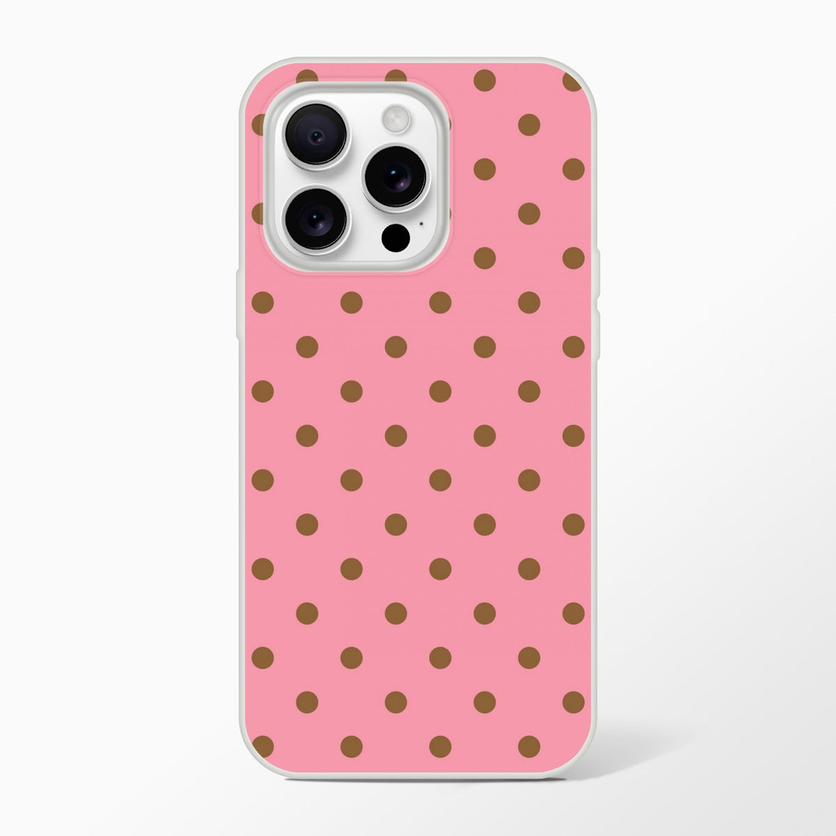 Retro pink iPhone case with brown polka dots and white bumper. Flexible TPU phone cover for iPhone 13-16 series.