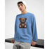 Blue men's graphic sweatshirt with a stressed teddy bear design worn by a model.