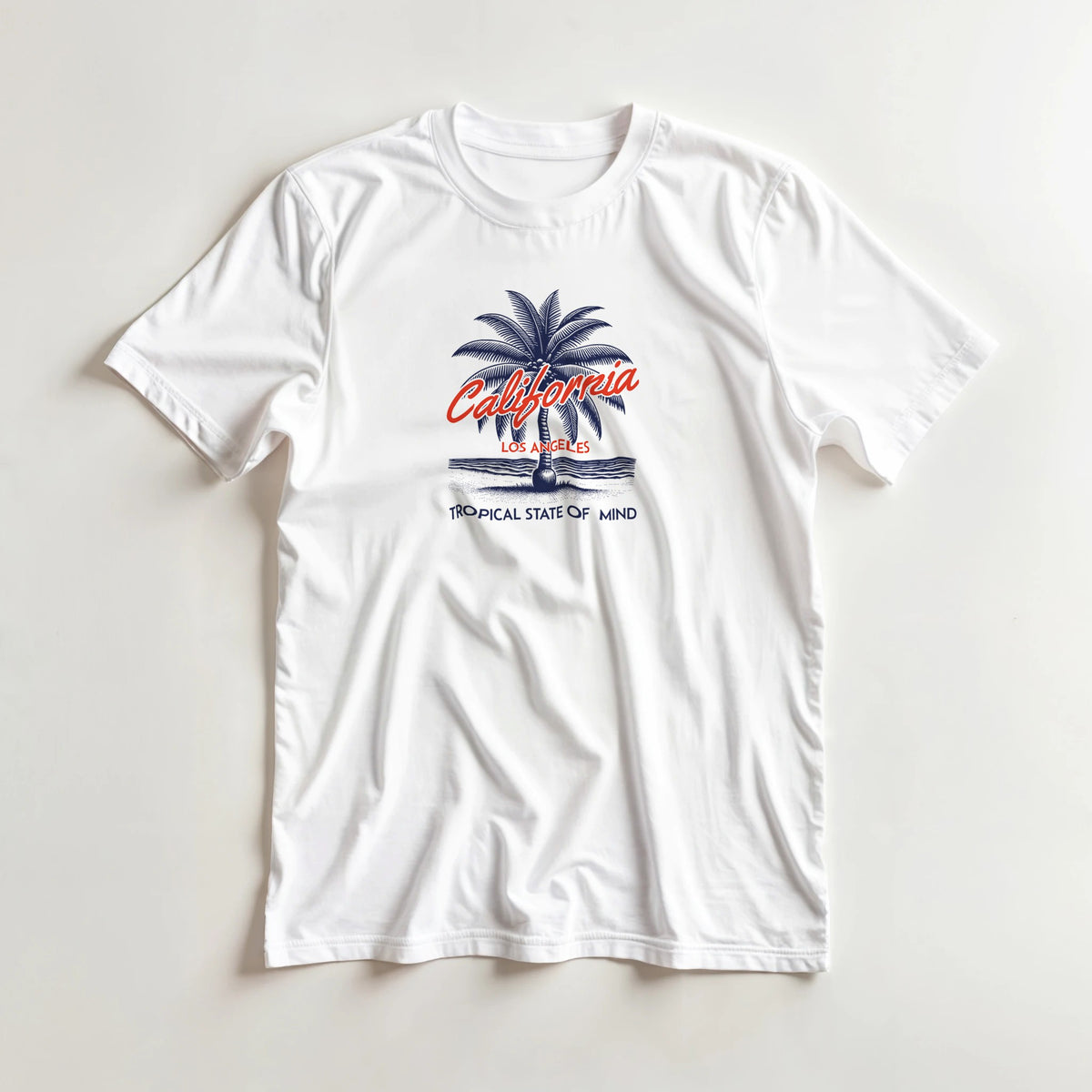 White women's California graphic tee with blue palm tree, California script, and 'Tropical State of Mind' text.