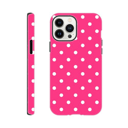 Hot pink & white polka dot tough iPhone case with dual-layer shock absorption for rugged protection and wireless charging access.