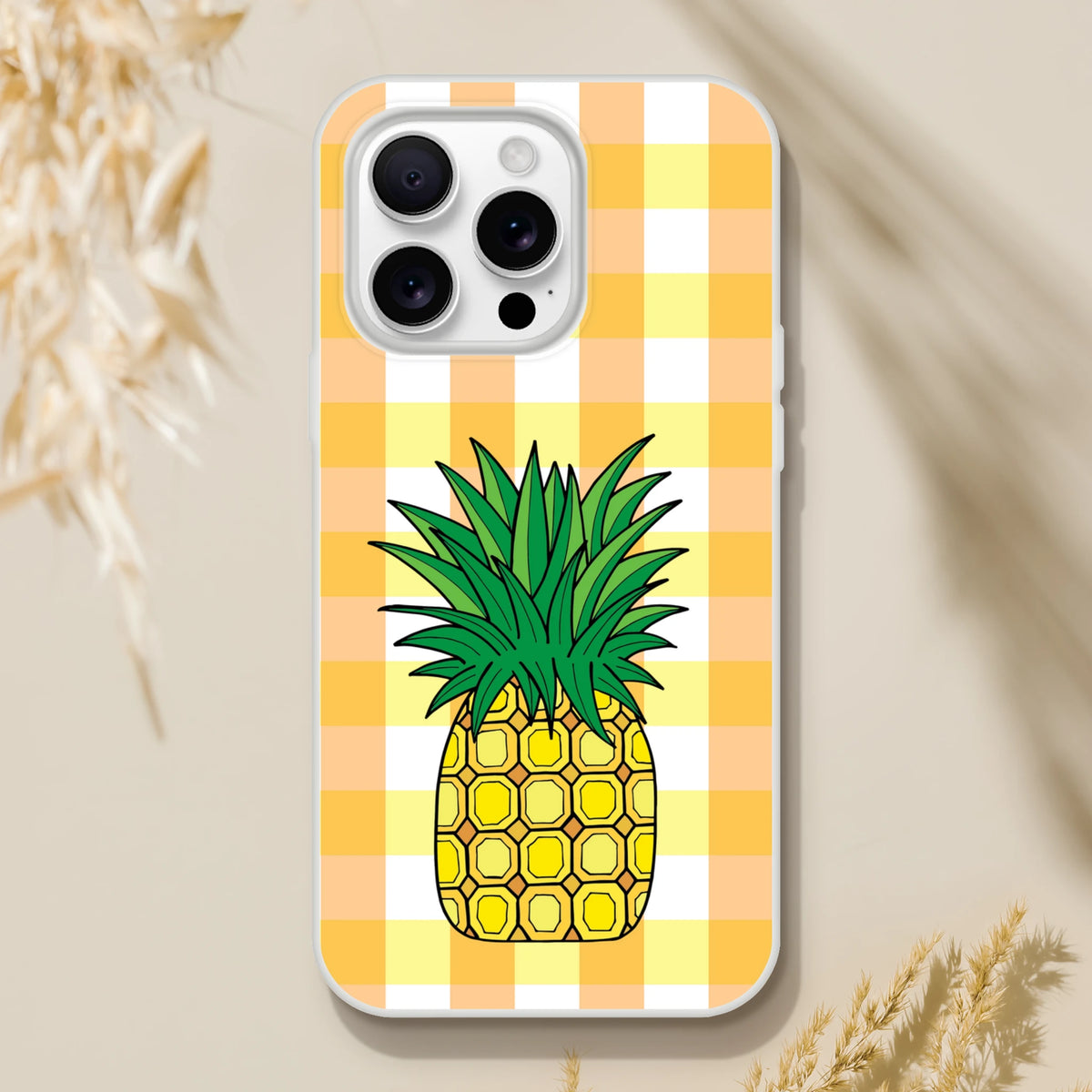 Pineapple graphic on yellow gingham iPhone case for iPhone 13-16, summer aesthetic.