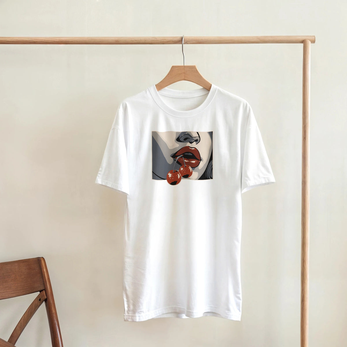 White women's crew-neck T-shirt in a soft cotton blend featuring pop-art lips with cherries on the chest.