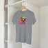 Gray men's graphic tee with a colorful dog wearing sunglasses on the chest.