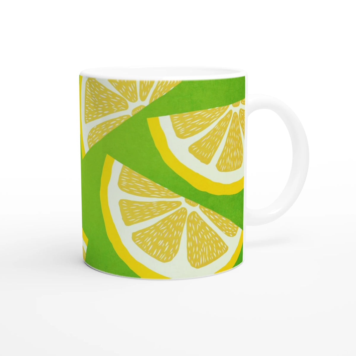 Cute lemon-slice patterned ceramic mug with a white handle in green and yellow.