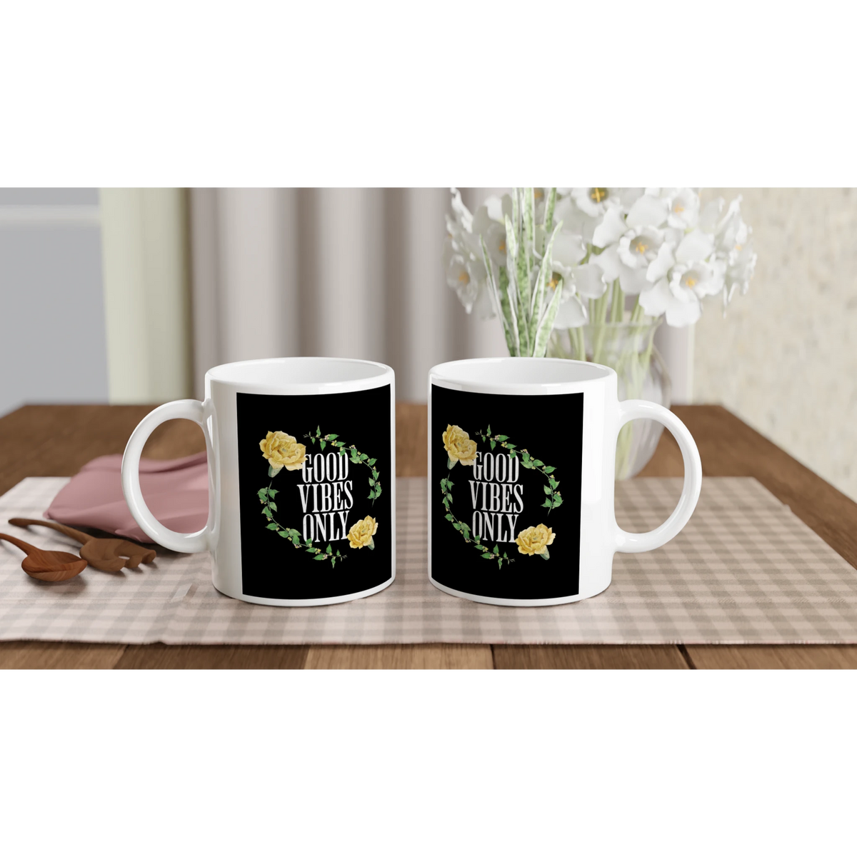 Pair of white ceramic mugs with black panels reading GOOD VIBES ONLY, surrounded by a yellow rose floral wreath.