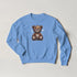 Blue cotton-blend men's sweatshirt with a stitched-stressed teddy bear graphic and spider-web background.