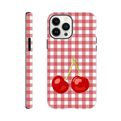 Red gingham iPhone case featuring two bright red cherries. Tough checkered cover protects phones 13-16 with a cute streetwear aesthetic.