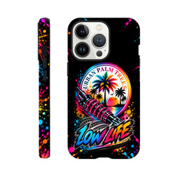 Low Life Petrolhead iPhone case with pink shock absorber, palm trees, and colorful paint splatter against a black background.