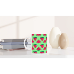 Ceramic coffee mug featuring a cute green summer watermelon slice pattern, perfect for desk or dorm use.