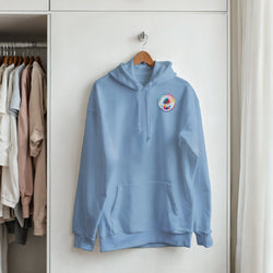 Light blue hoodie with a retro circular palm tree graphic on the chest, featuring a front pocket and drawstrings.