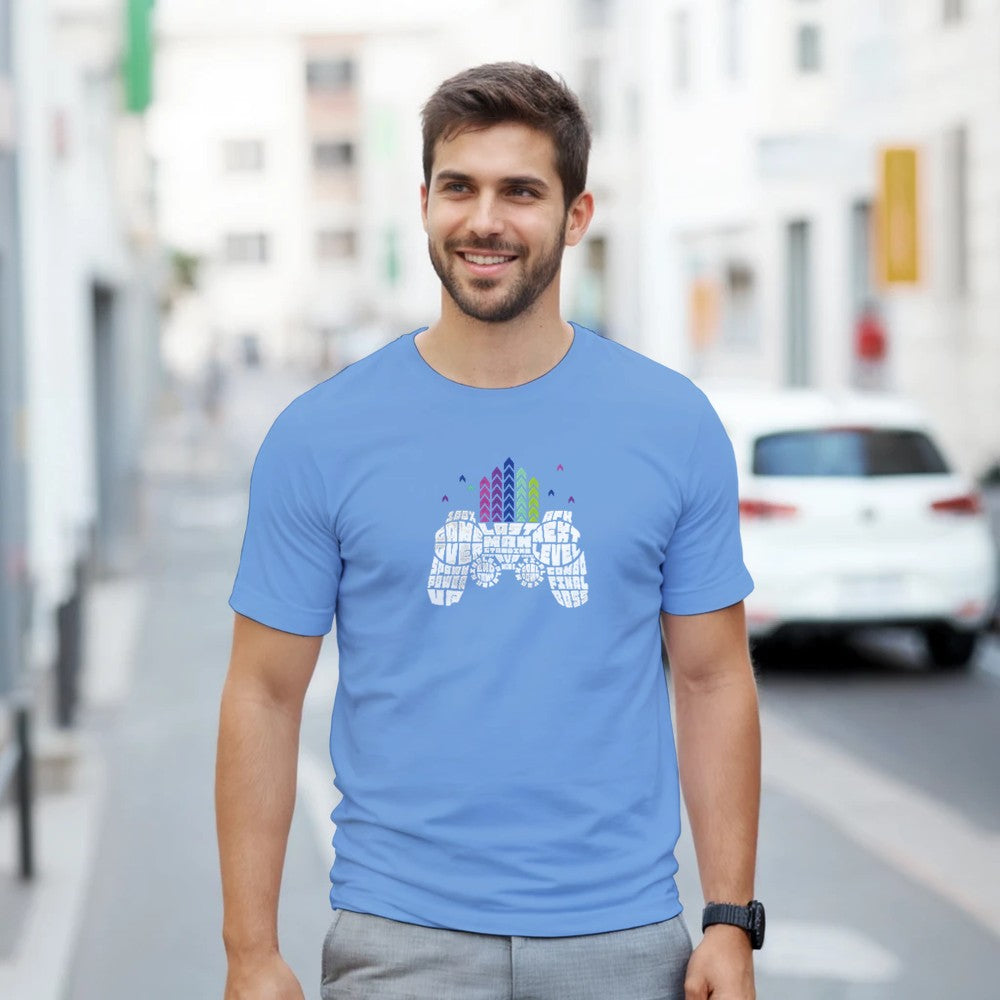 Man wearing light blue retro gamer T-shirt with pixel-art controller and skyline graphic.
