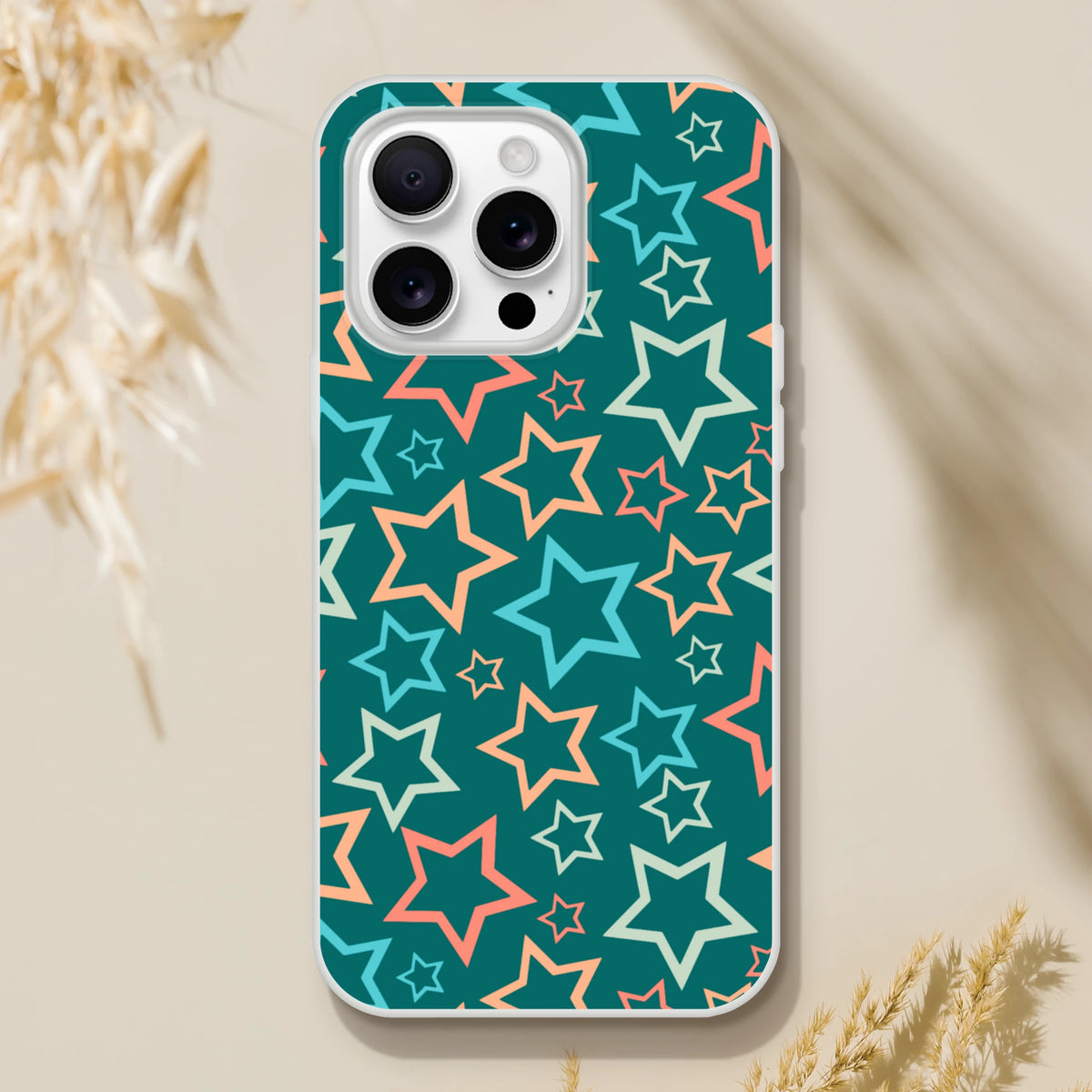 Retro multicolour star iPhone case for 13-16 with teal background and Y2K pastel star print.