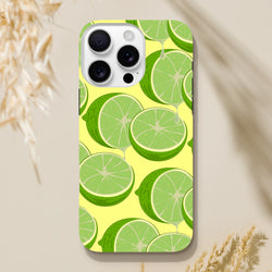 Fresh green lime slices with dripping juice on a yellow iPhone case, offering tough citrus style and impact protection.