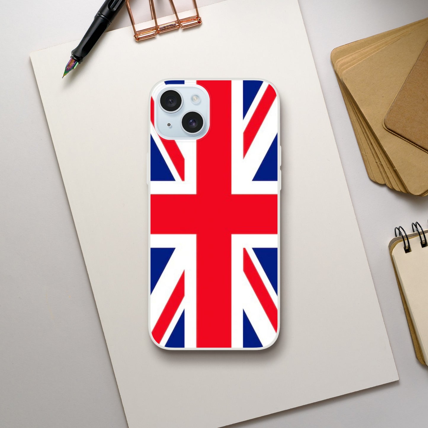 iPhone case with Union Jack design on a desk with stationery items 25