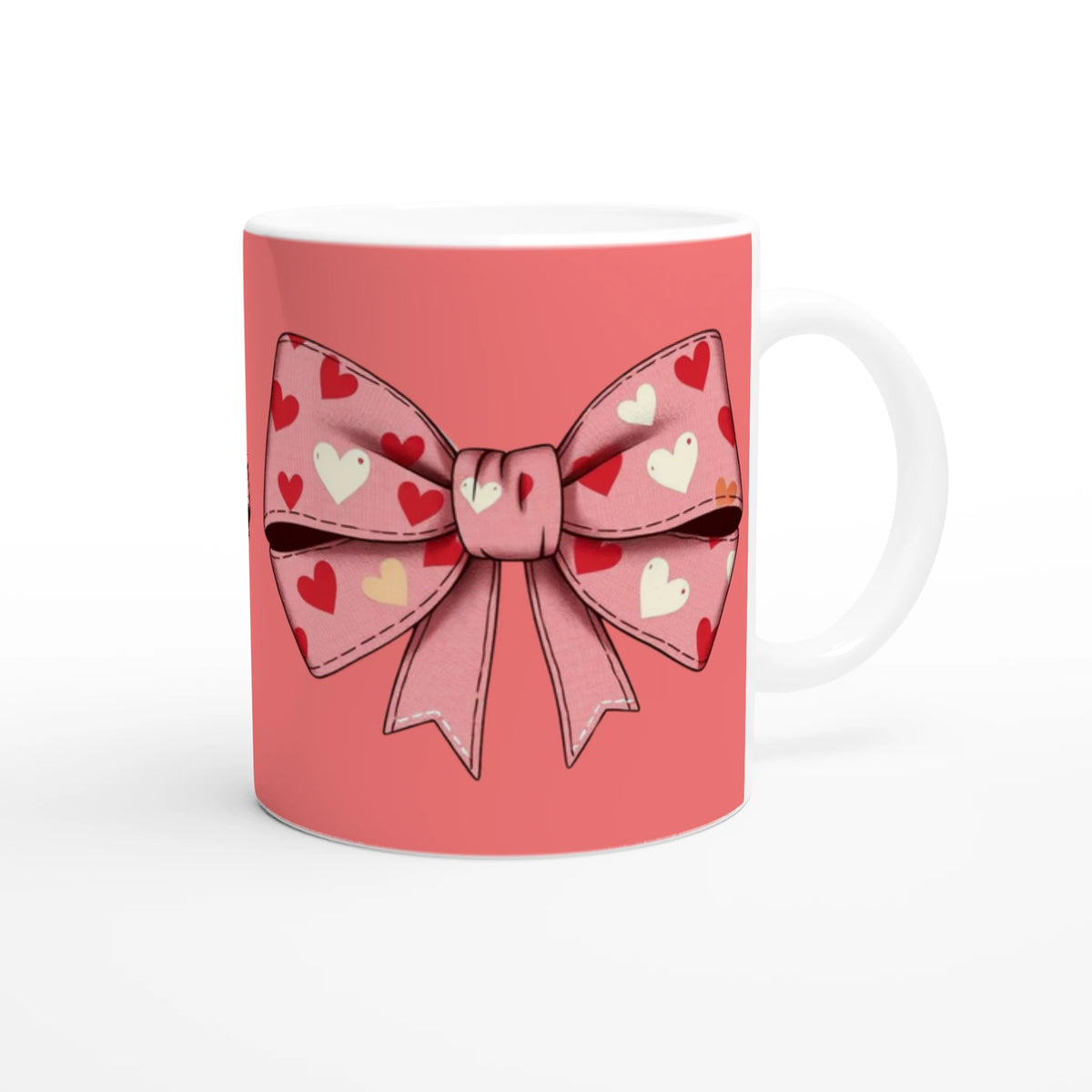 Cute pink and cream coquette bow mug with a heart-pattern bow design for coffee or tea.