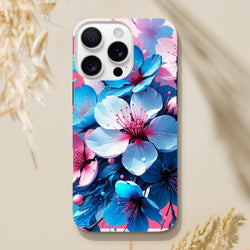 Vibrant blue and pink blossom tough iPhone case for models 13-15. A durable floral phone cover designed for urban commuters and digital creators.