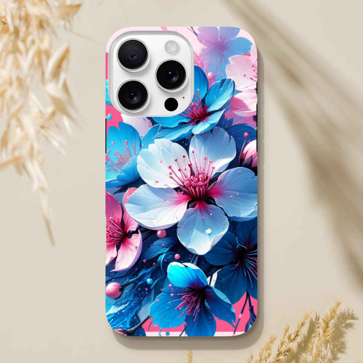 Vibrant blue and pink blossom tough iPhone case for models 13-15. A durable floral phone cover designed for urban commuters and digital creators.