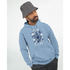 Man wearing light blue cotton blend hoodie with It's OK Not To Be OK floral graphic and front pocket.