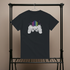 Black t-shirt with a graphic design on a hanger against a beige background