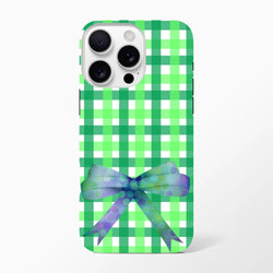 Green gingham iPhone case featuring a purple polka dot bow and coquette streetwear aesthetic for iPhone 13-16