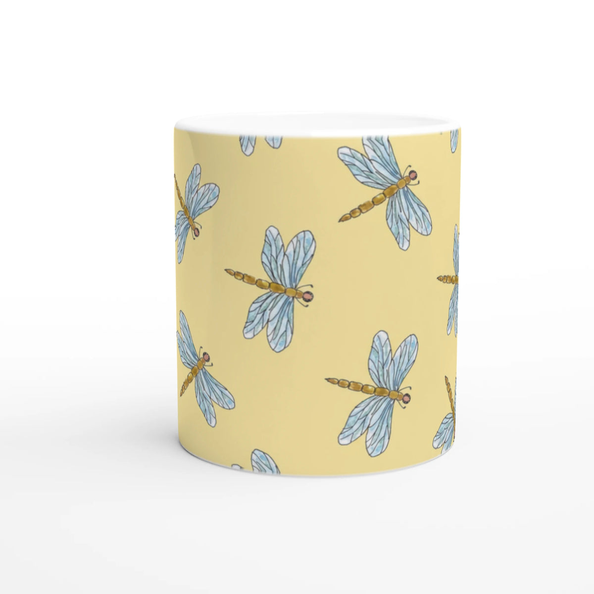 Yellow Dragonfly Mug with blue dragonfly pattern on ceramic coffee cup.
