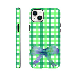 Green gingham iPhone case featuring a purple polka-dot bow print. Cute coquette tough phone cover for iPhone 13-16.