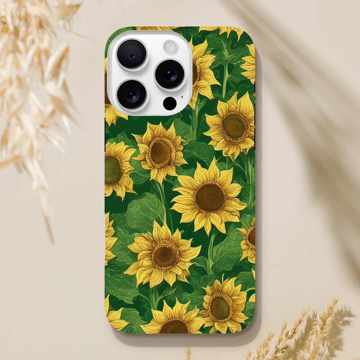 Tough iPhone case featuring a vibrant wraparound yellow sunflower and green leaf pattern on a dark background for drop protection.