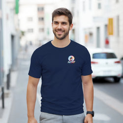 Man wearing navy blue "Full Send" graphic tee with palm tree logo. Custom car culture streetwear for men, styled with grey pants on city street.