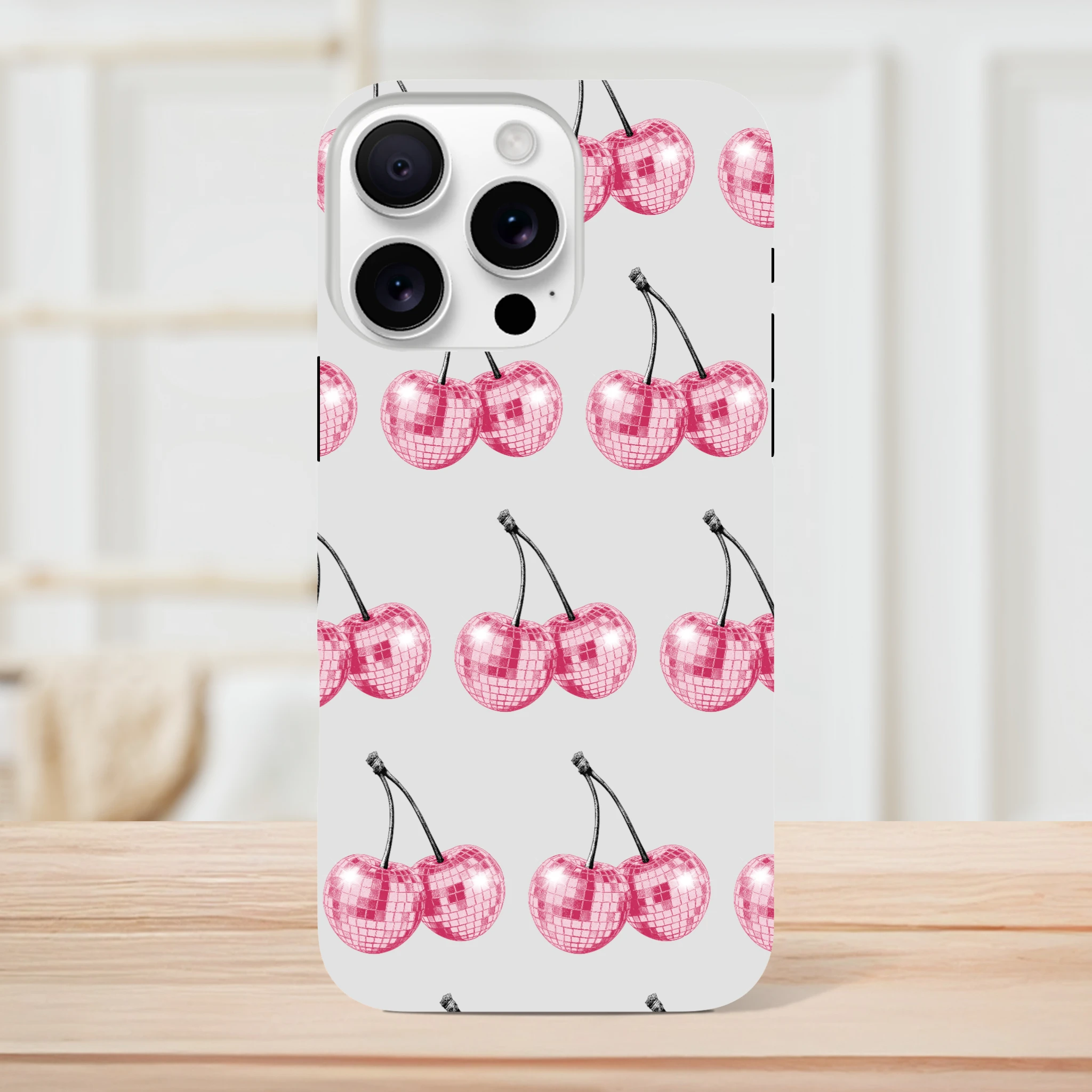 Glitter ball cherries pattern on light-gray iPhone case with dual-layer wraparound protection.