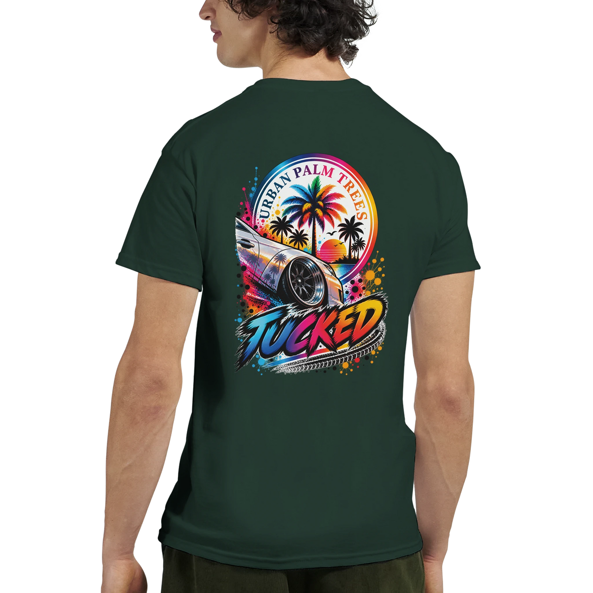 Back view of a dark green "Tucked" petrolhead t-shirt featuring a colorful modified car and palm tree sunset graphic.