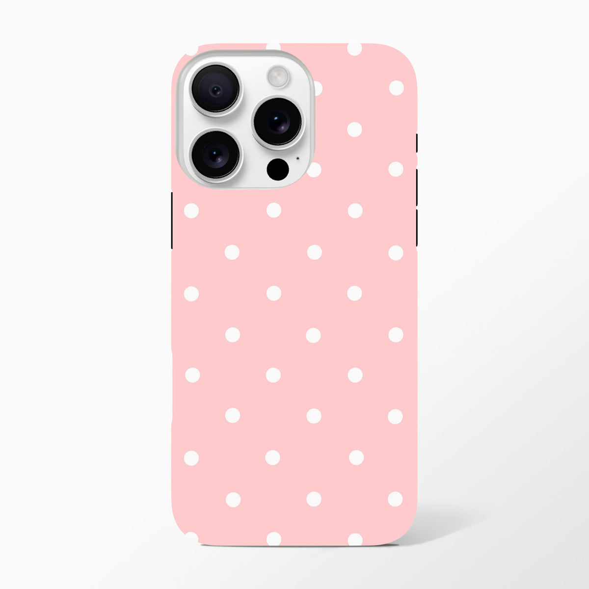 Pastel pink iPhone case with white polka dots offering tough dual-layer drop protection and shock-absorbing TPU for daily use.