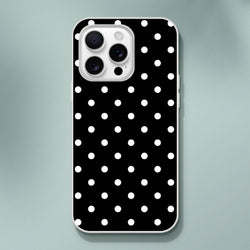 Retro black and white polka dot iPhone case with slim matte TPU shell, impact absorption, and wireless charging compatibility.
