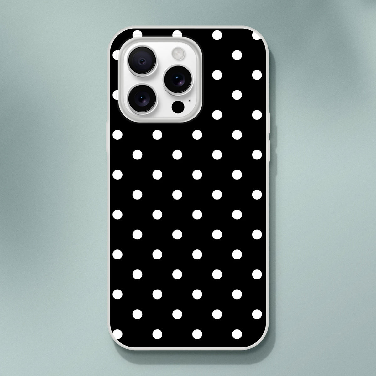 Retro black and white polka dot iPhone case with slim matte TPU shell, impact absorption, and wireless charging compatibility.