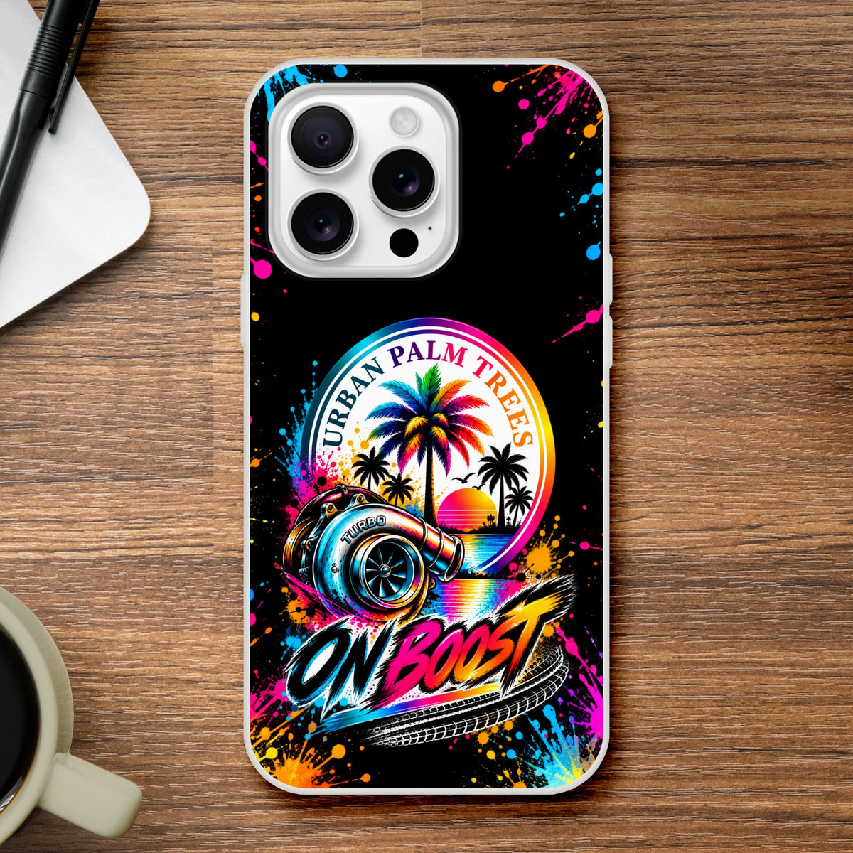On Boost iPhone case featuring a colorful turbocharger, Urban Palm Trees graphic, and vibrant paint splatter art on a black background.