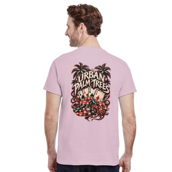 Man wearing pink t-shirt featuring retro Urban Palm Trees poker graphic on back with cards, chips, and dice.