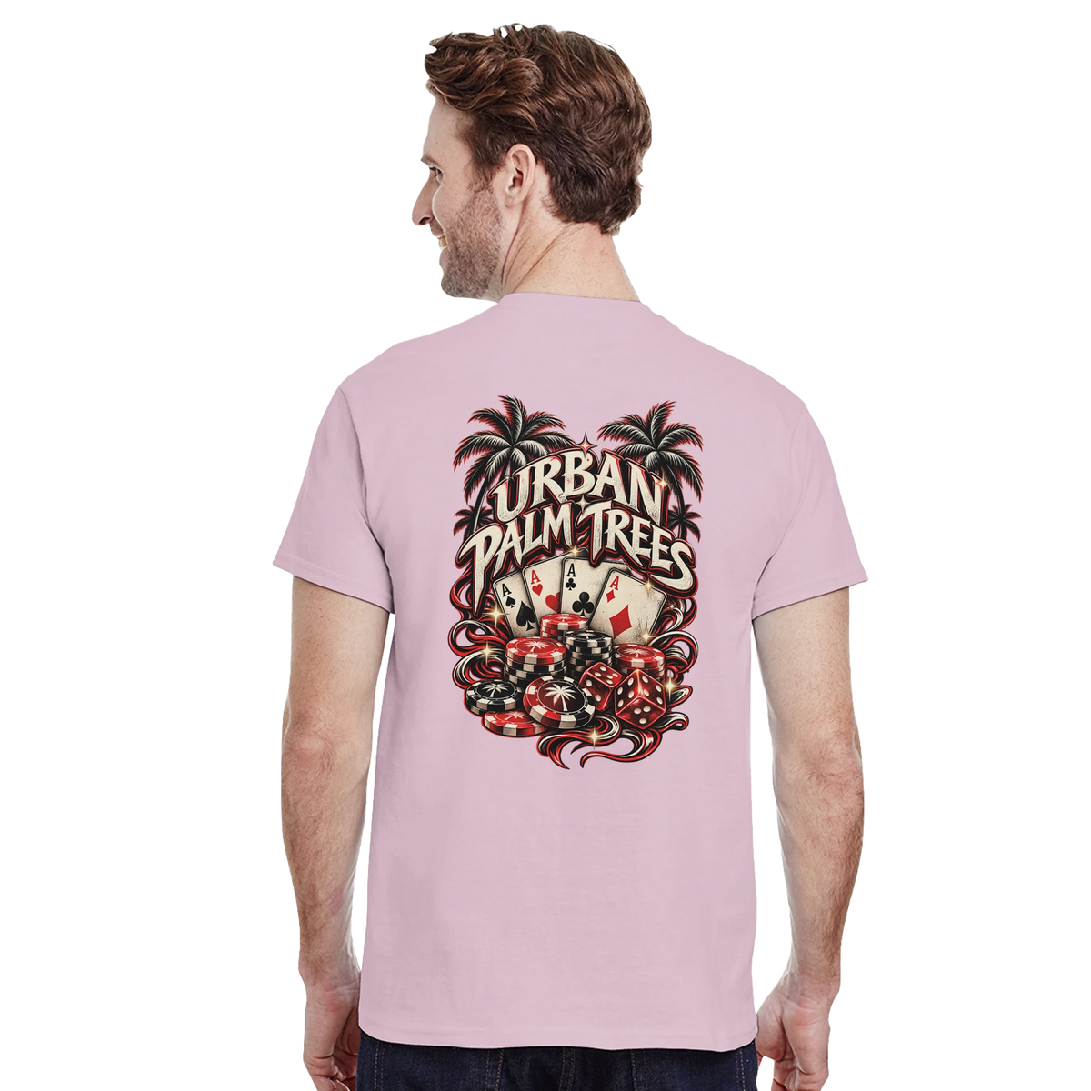 Man wearing pink t-shirt featuring retro Urban Palm Trees poker graphic on back with cards, chips, and dice.