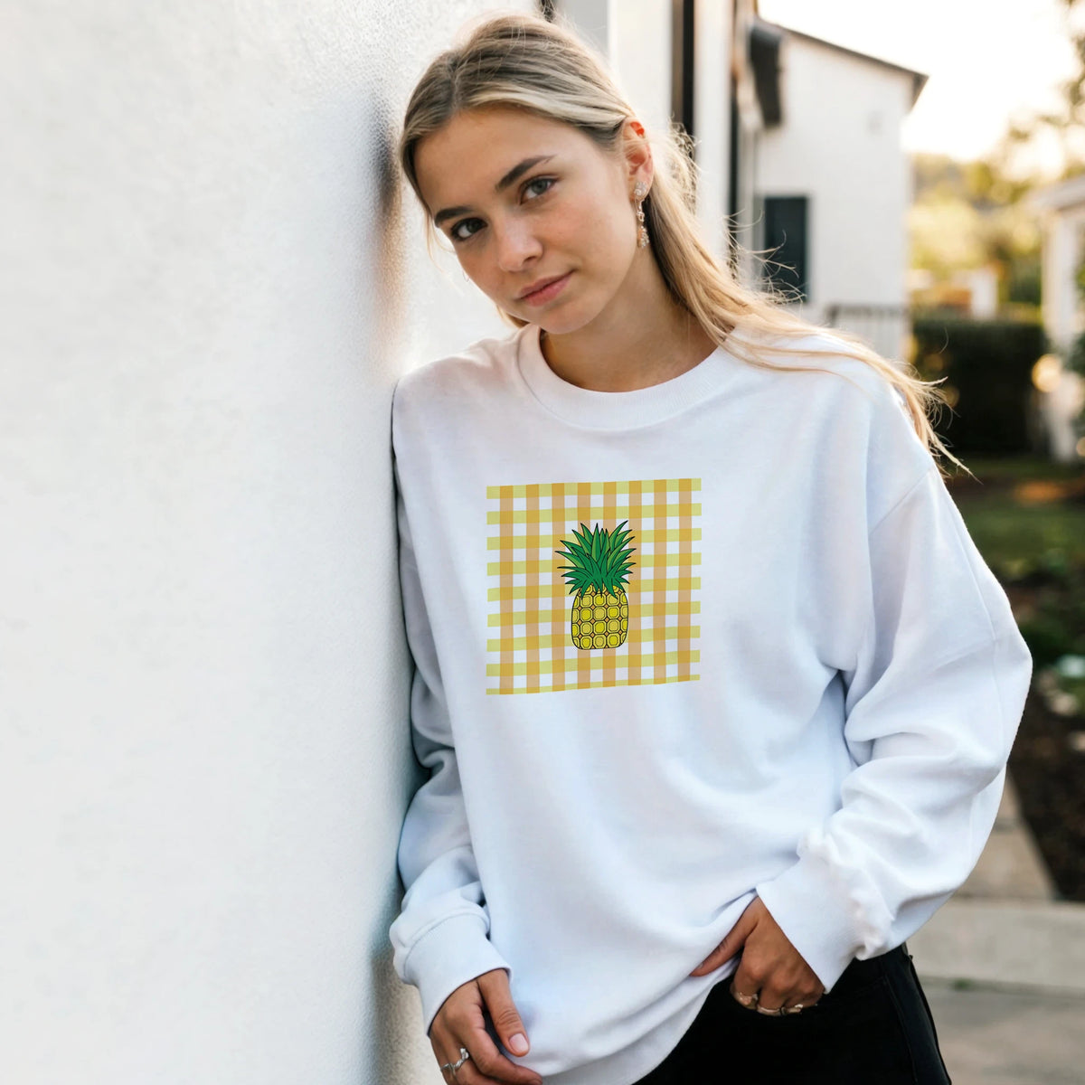 White retro sweatshirt featuring a yellow gingham square with a tropical pineapple graphic for a vintage streetwear look.
