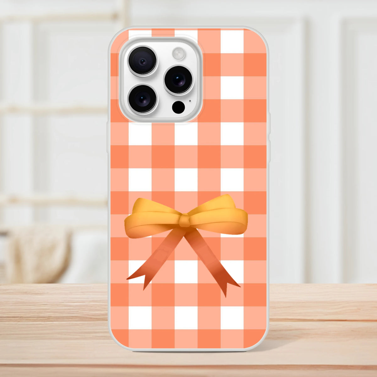 Orange gingham bow iPhone case for iPhone 13-16, with a cute coquette aesthetic.