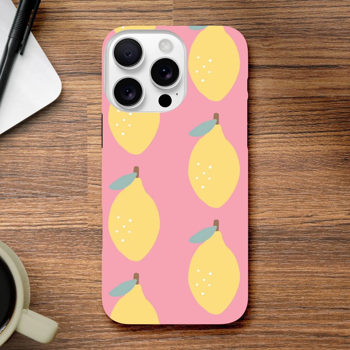 Pink iPhone case featuring a cute yellow lemon fruit pattern on a pink background, offering tough protection for daily urban use.