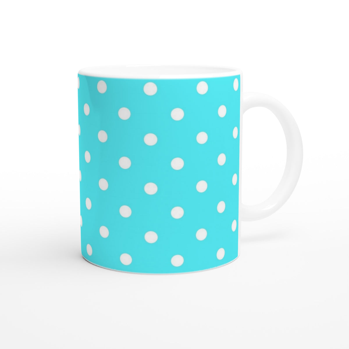 Retro aqua blue ceramic mug with white polka dots. Cute vintage coffee cup for daily brews, home office, or gifting.