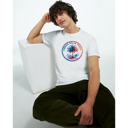 Man wearing white Urban Palm Trees Tee for Men with colorful palm tree graphic.